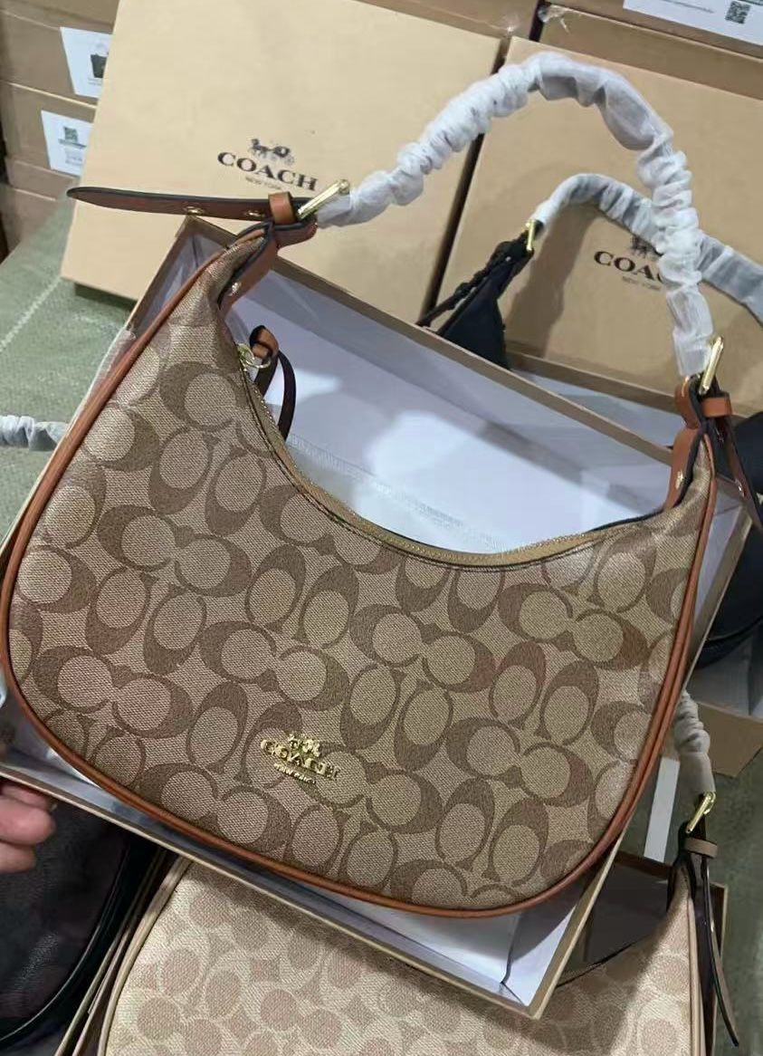 Coach handbag with patterned handle on a matching box
