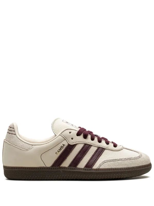 Side profile of Adidas Samba sneaker with burgundy stripes