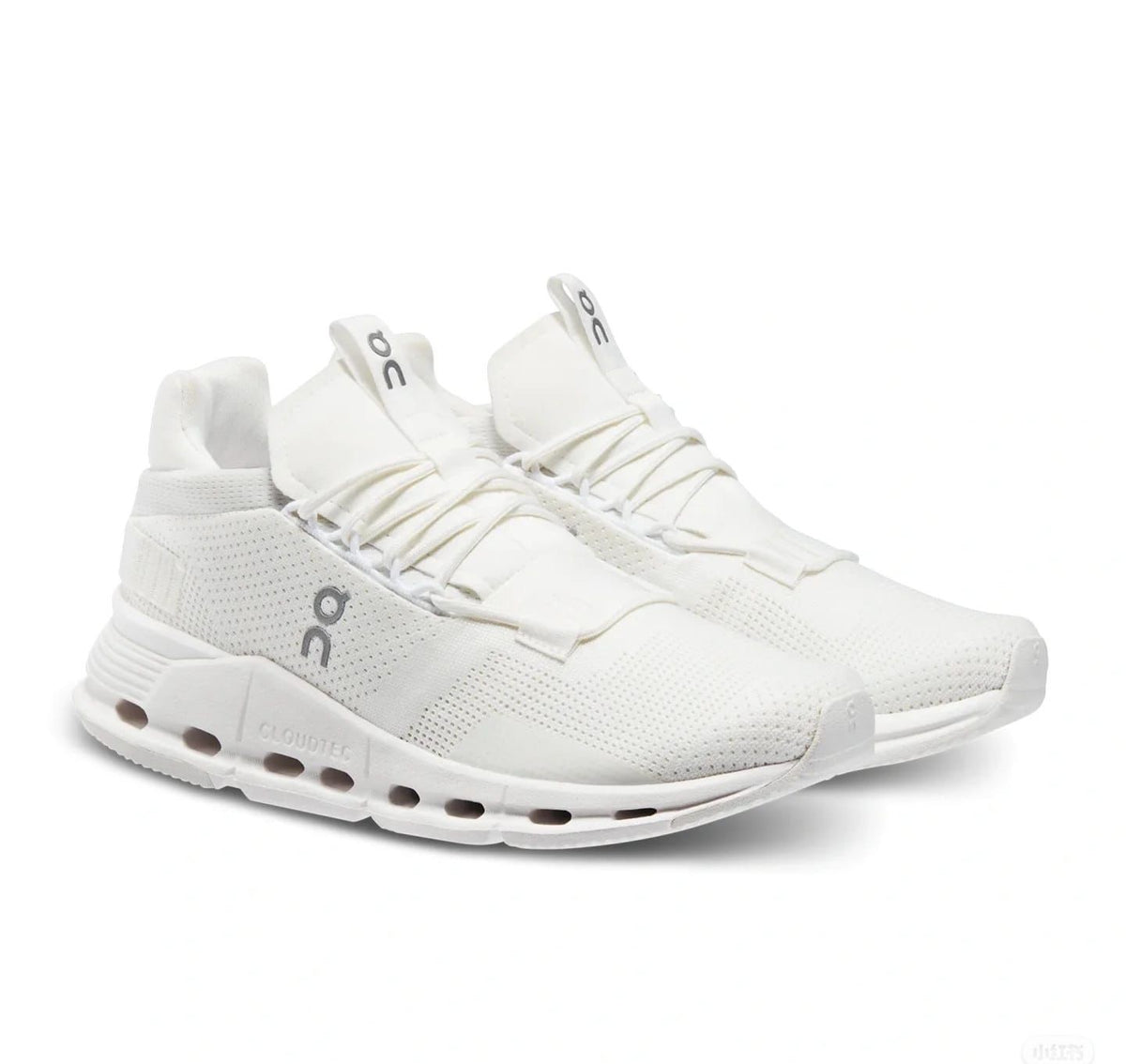 Pair of white and ivory On Cloudnova lifestyle sneakers
