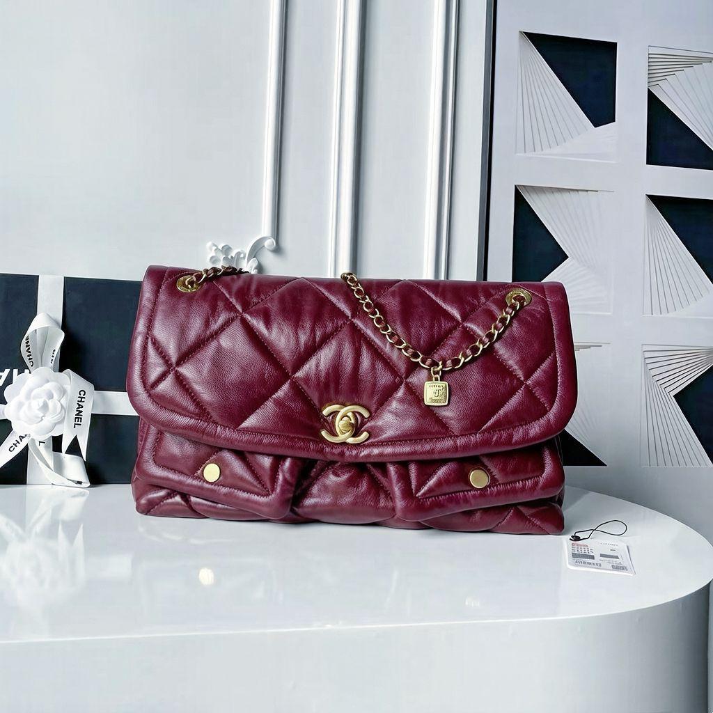 Deep burgundy red quilted leather flap shoulder bag with gold hardware   