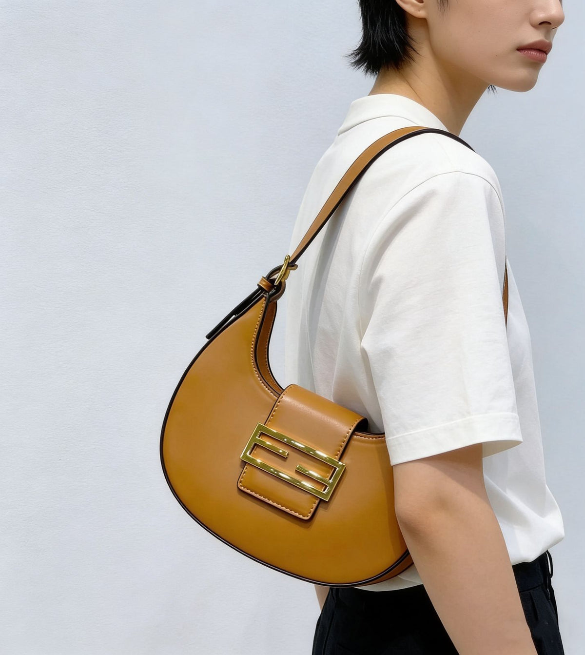 Woman carrying Fendi style shoulder bag with casual outfit