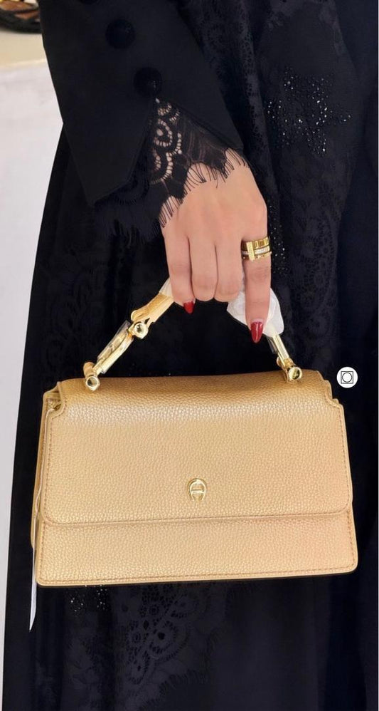 Cream Aigner women’s handbag available in UAE