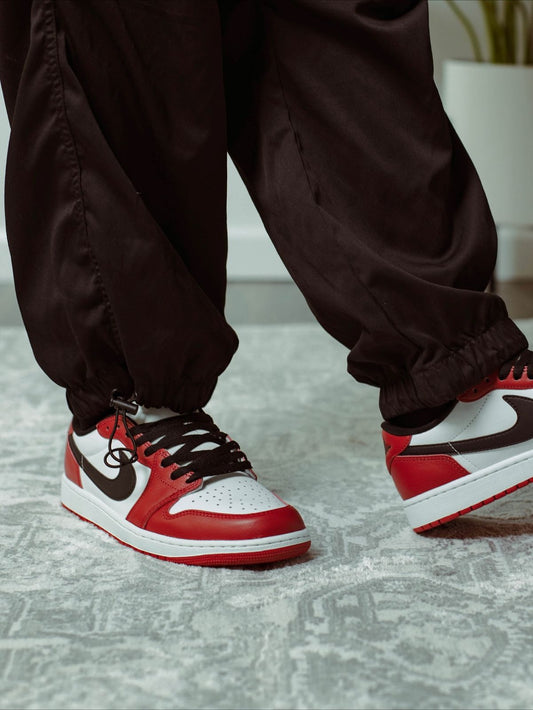 Air Jordan 1 Low red white black sneakers on feet