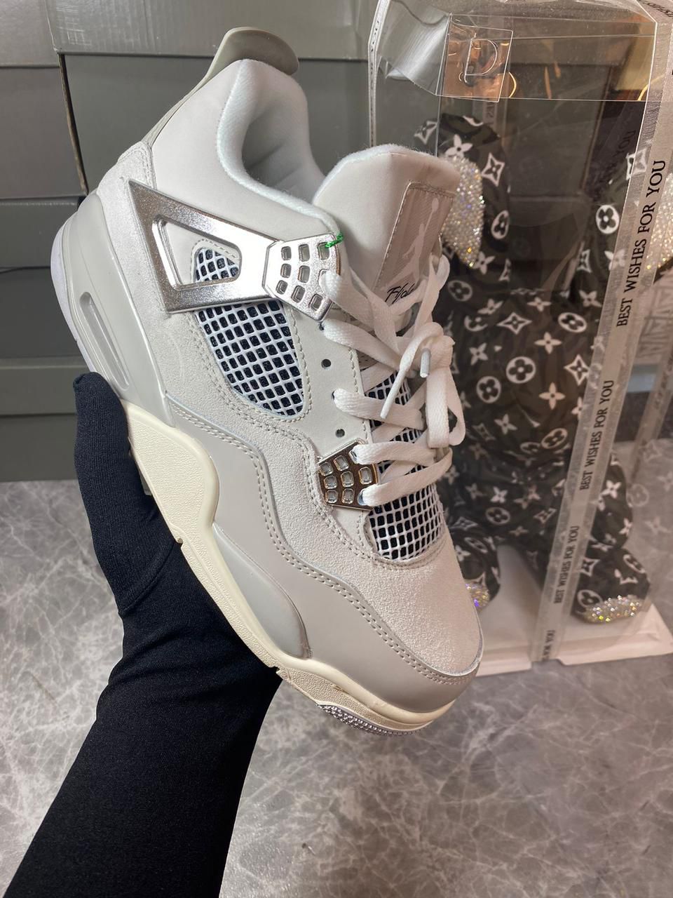 Air Jordan 4 Retro Frozen Moments women’s grey sneakers