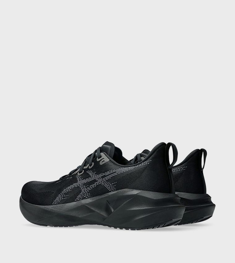 Pair of black ASICS Novablast running shoes