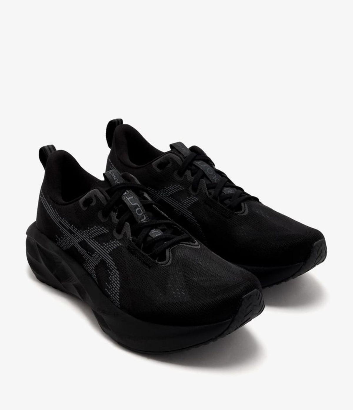Angled view of black ASICS Novablast sneakers