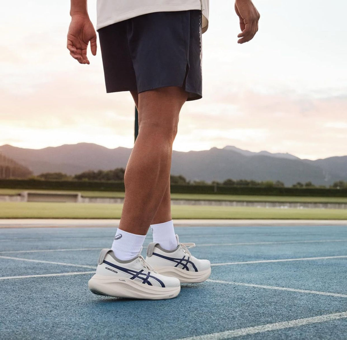 ASICS SONICBLAST running shoes shown on a track