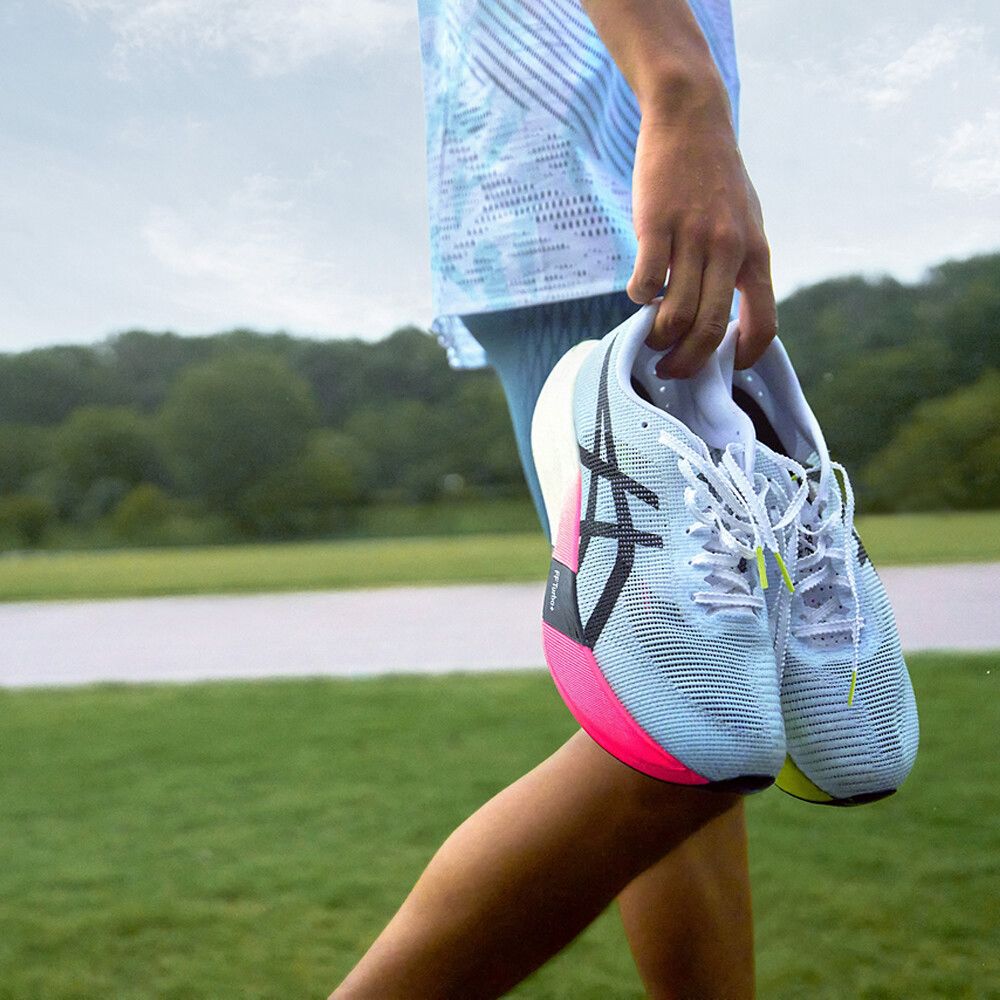 ASICS white black pink sneakers outdoor lifestyle view