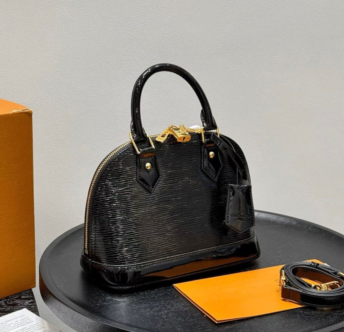 Black Louis Vuitton style women's top handle bag
