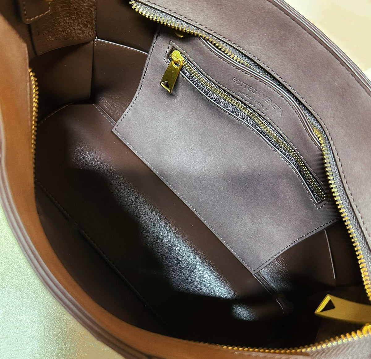 Interior compartment detail of Bottega style women's handbag