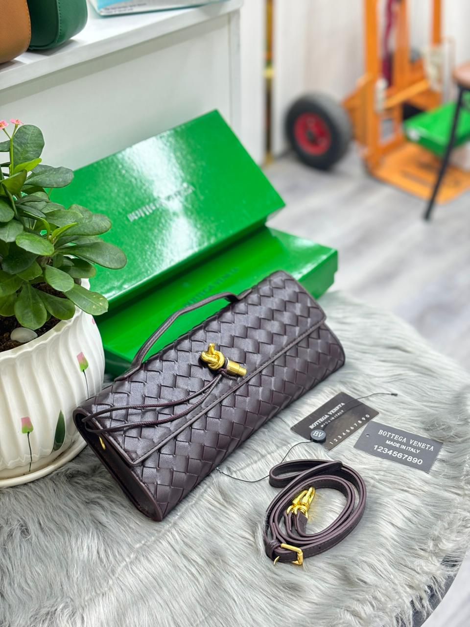 Deep plum Bottega Veneta woven leather knot clutch bag with strap