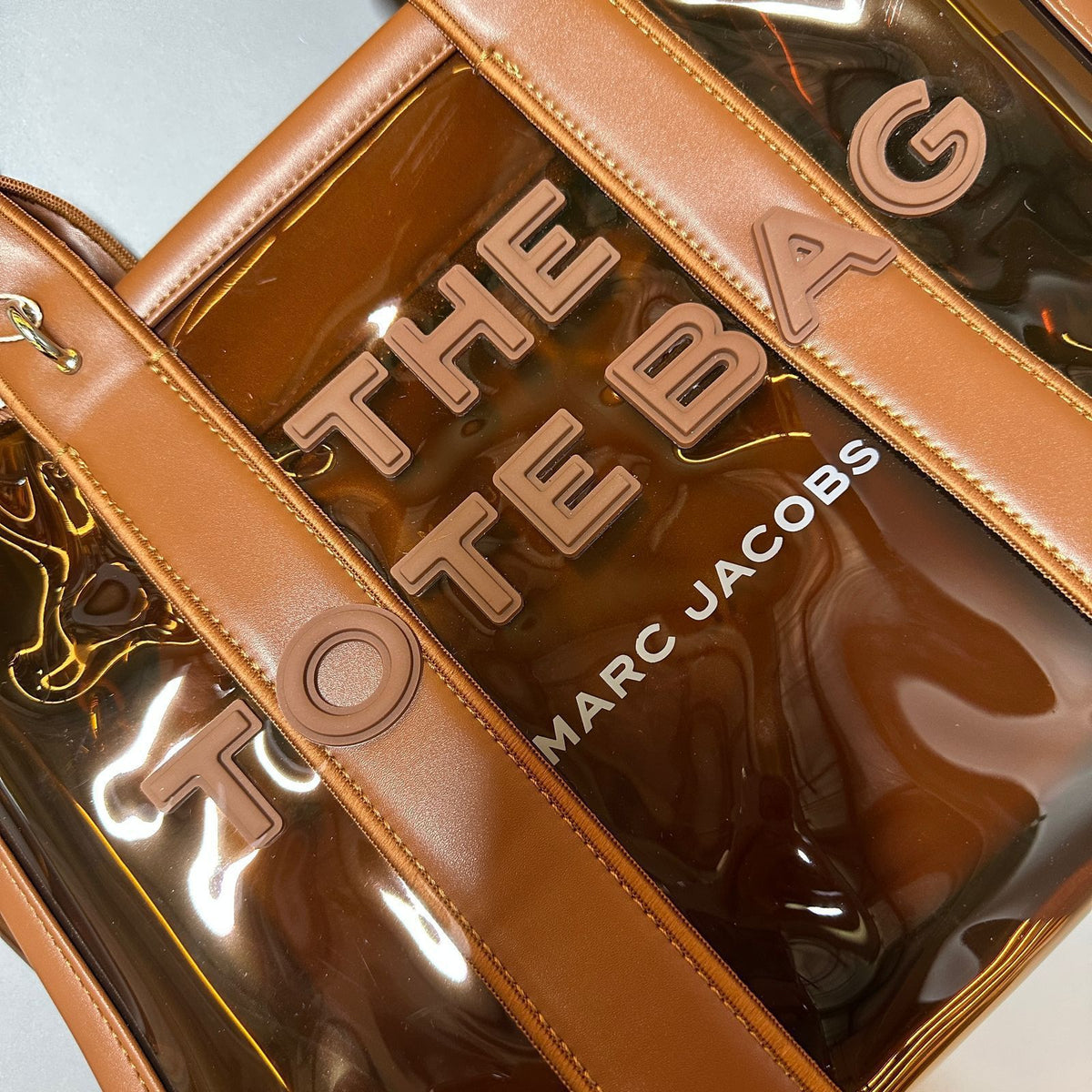 Brown transparent tote bag for women with logo design