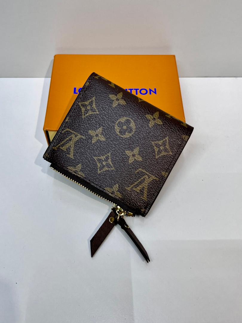 Brown monogram women’s wallet with black wrist strap