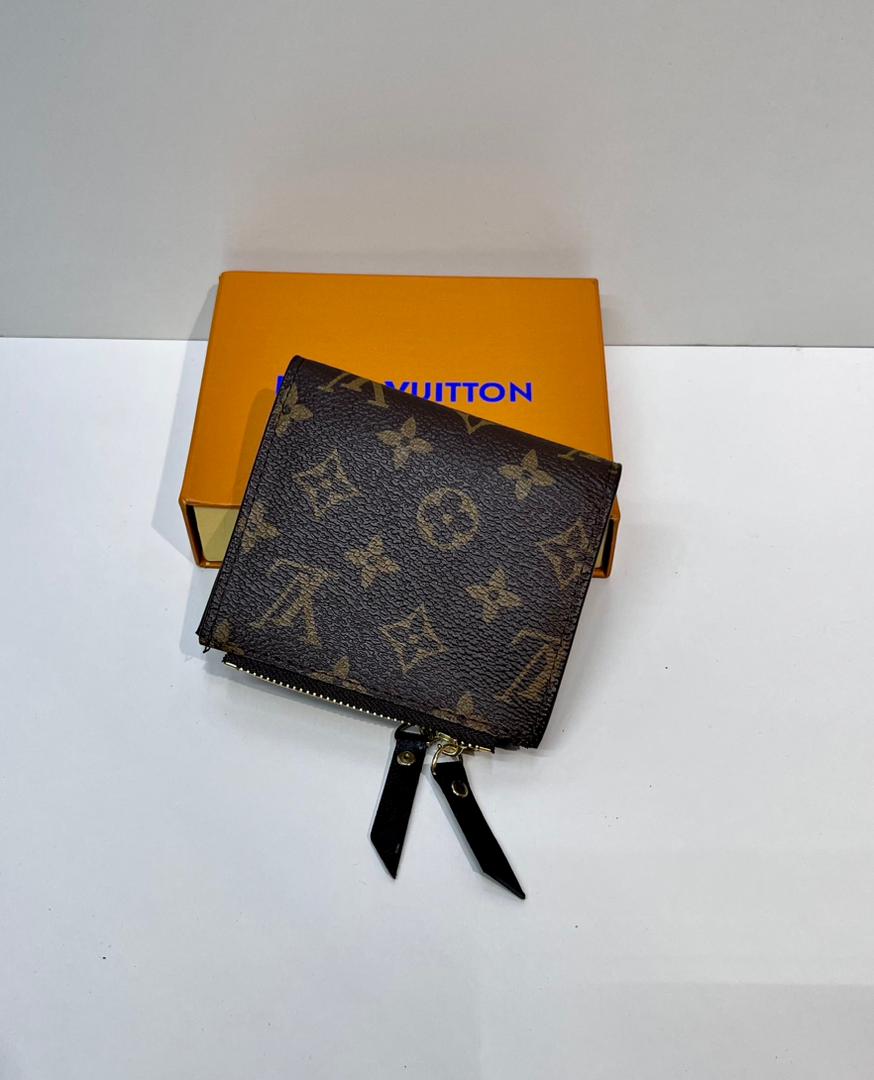 Brown monogram zip wallet with black wristlet strap