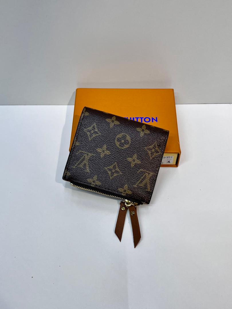 Brown monogram compact wallet with matching wrist strap