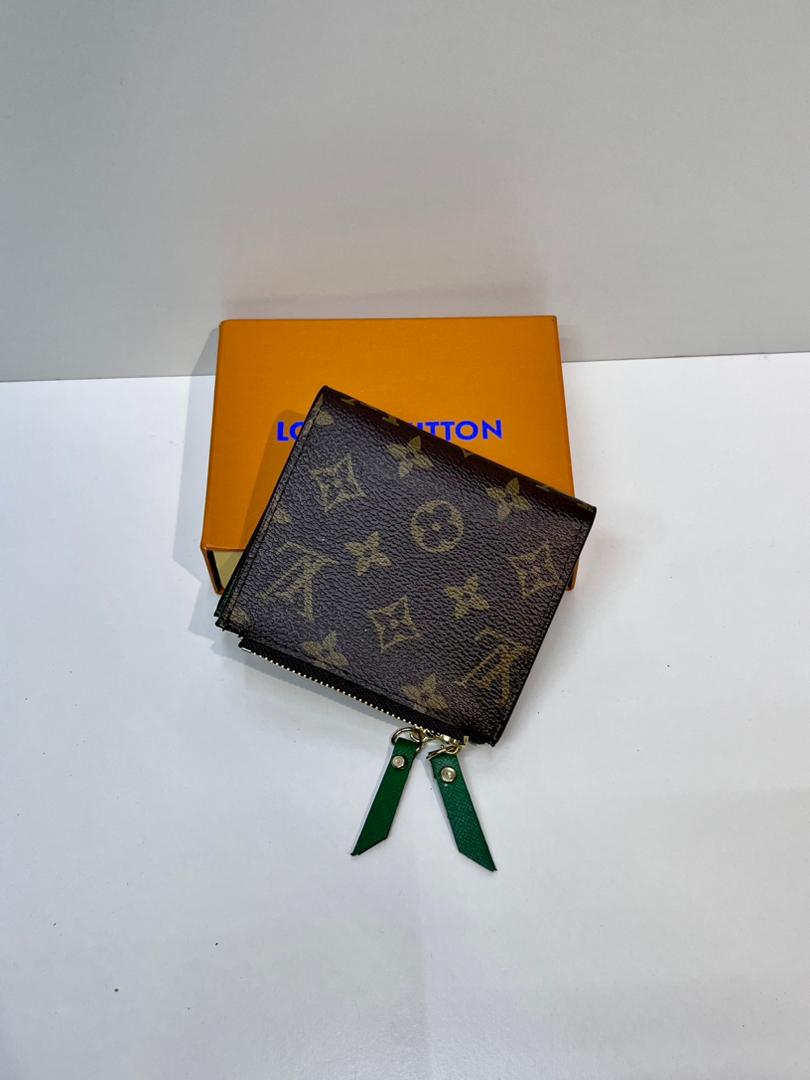 Brown monogram compact wallet with green wrist strap