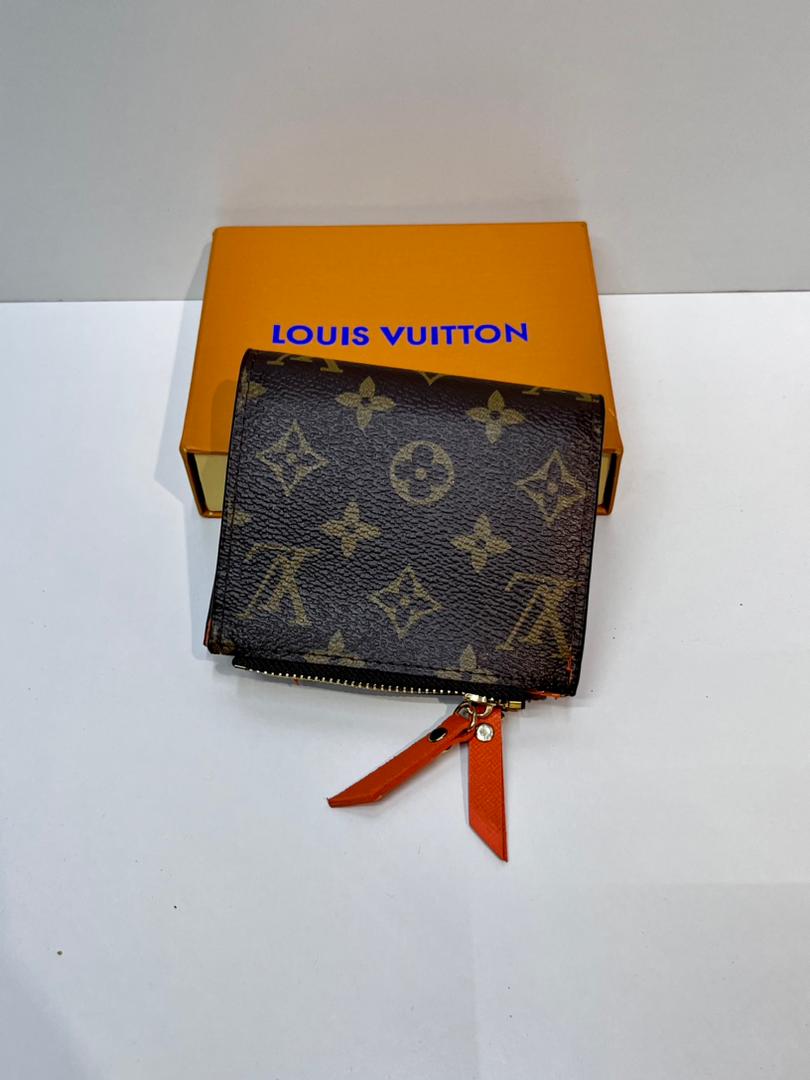 Brown monogram zip wallet with orange wrist strap