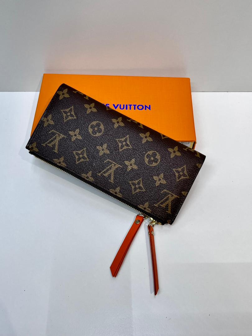 Brown monogram women’s wallet with red wrist strap