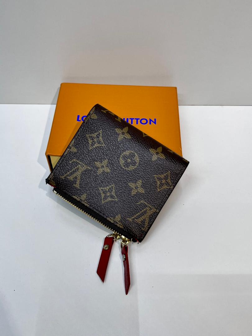 Brown monogram women’s wallet with red wrist straps
