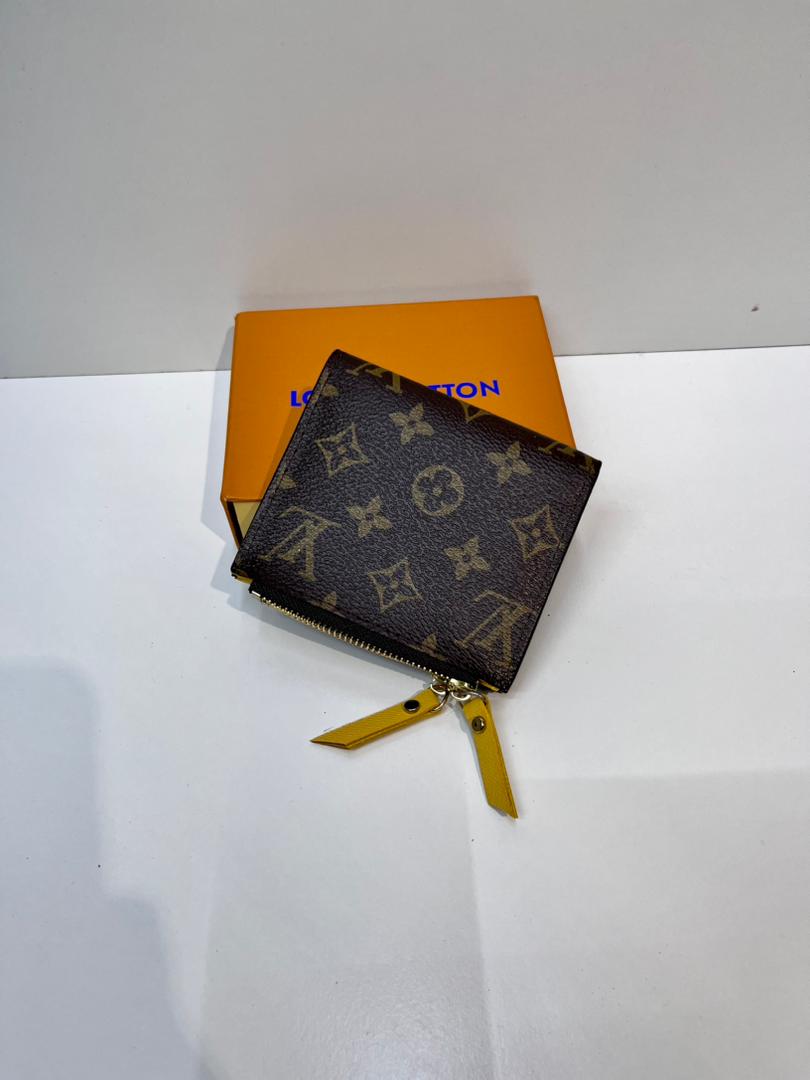 Brown monogram compact wallet with yellow wrist strap