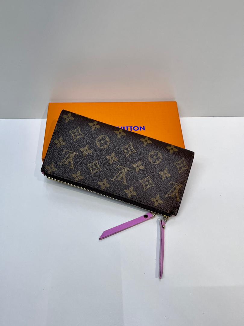 Brown monogram zip wallet with pink wrist strap