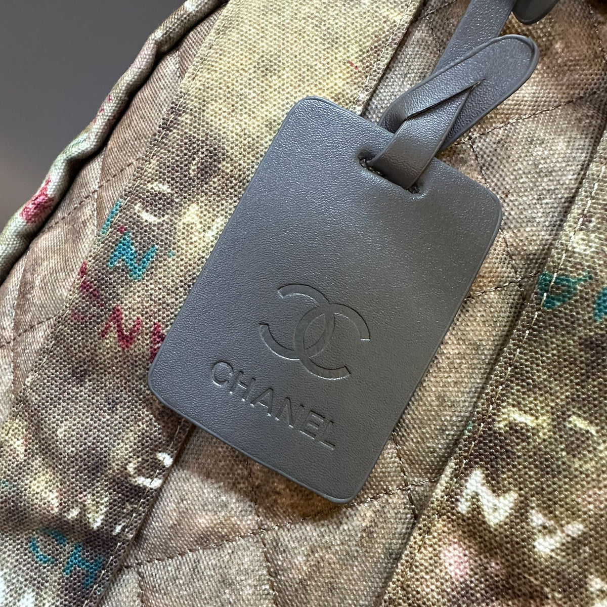 Chanel luggage tag on a patterned surface