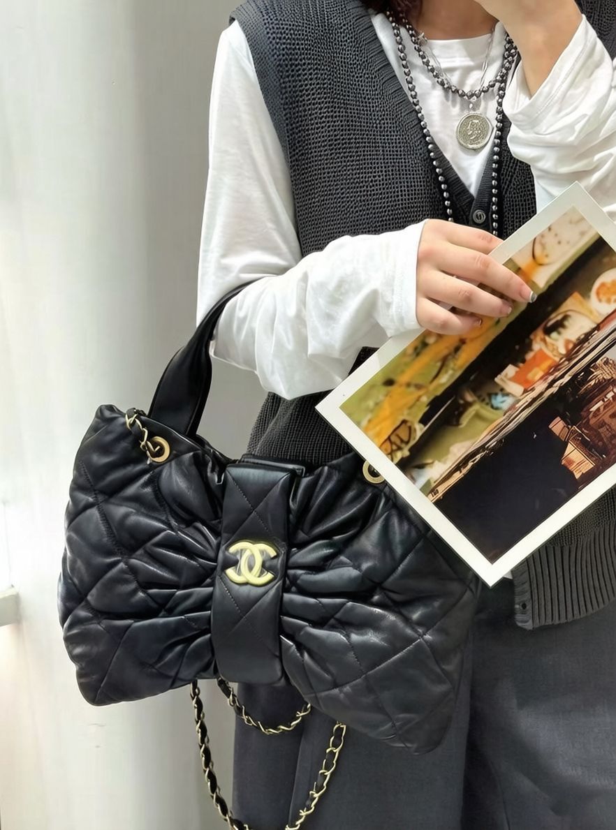 Chanel quilted CC black chain shoulder women's bag lifestyle at Meya Luxury Brand