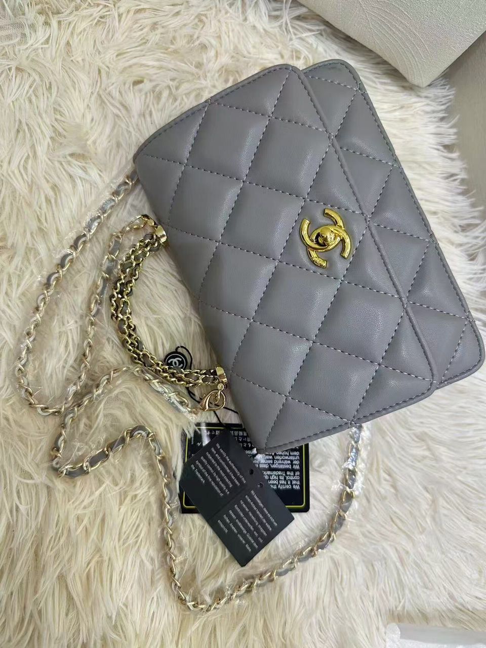 Charcoal grey Chanel quilted leather mini flap shoulder bag with gold chain
