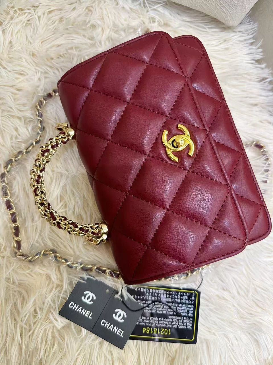 Deep burgundy red Chanel quilted leather flap bag with gold chain strap