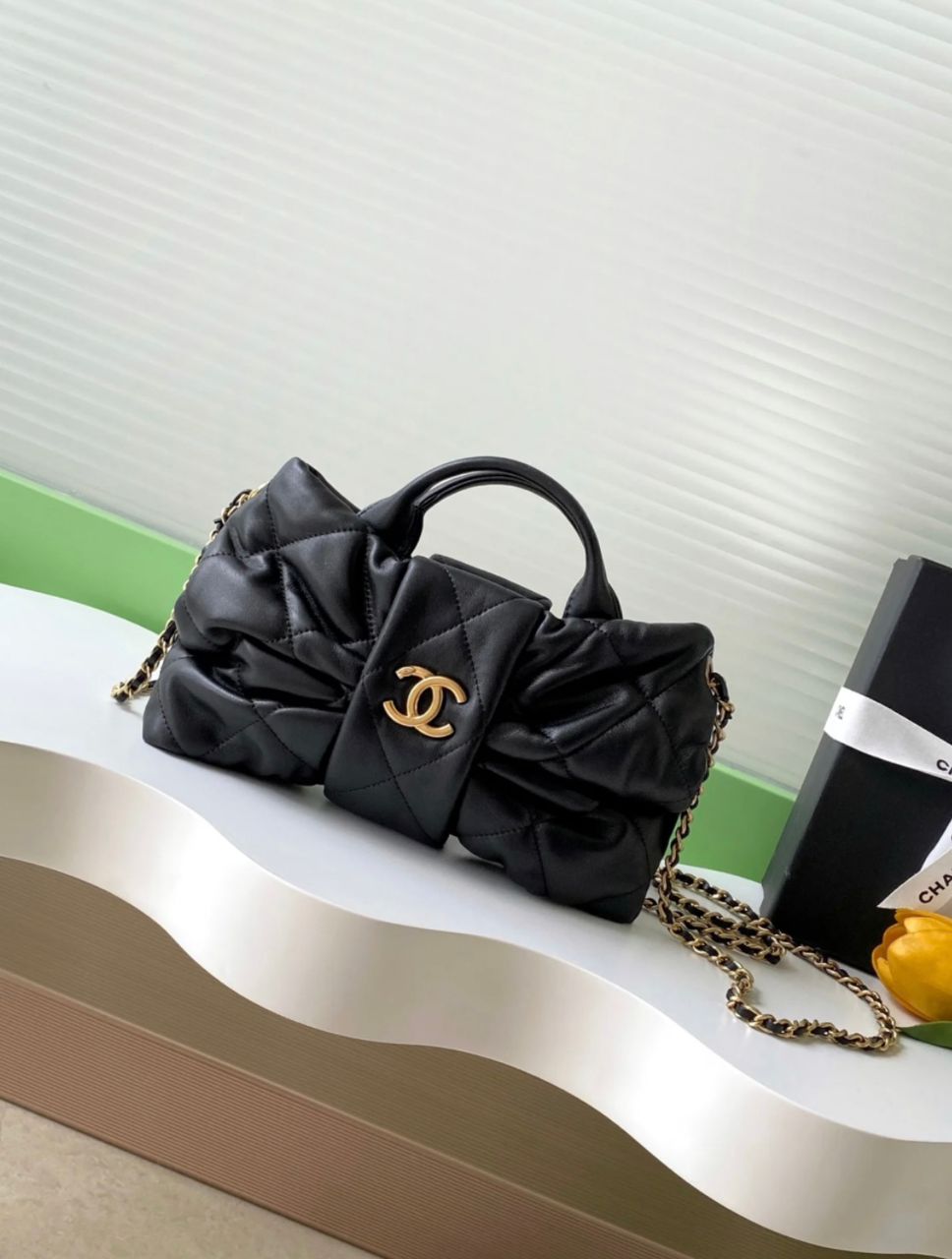 Black quilted Chanel mini crossbody bag