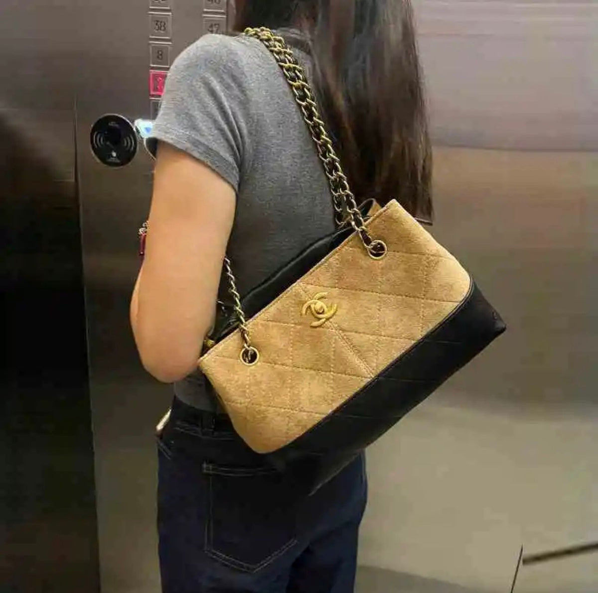 Chanel women's shoulder bag with chain strap and quilted design