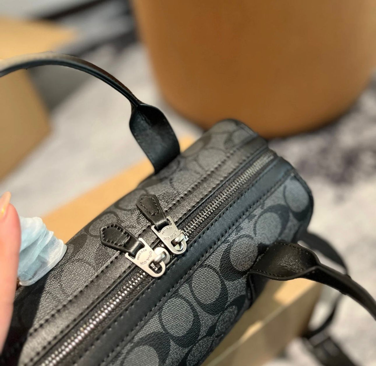 Coach style handbag gold hardware and logo detail
