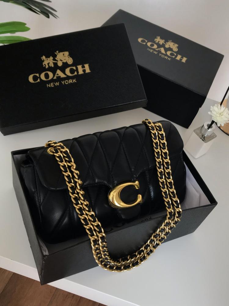 Black Coach women’s quilted crossbody bag