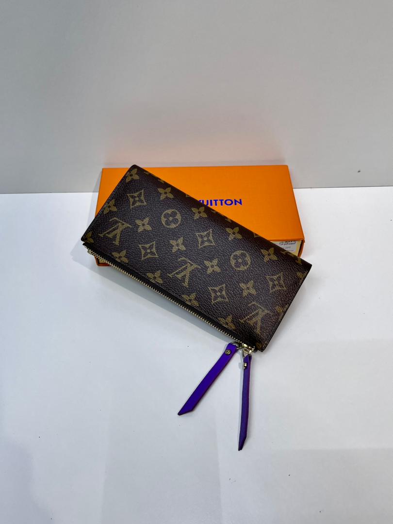 Dark monogram women’s wallet with purple wrist strap