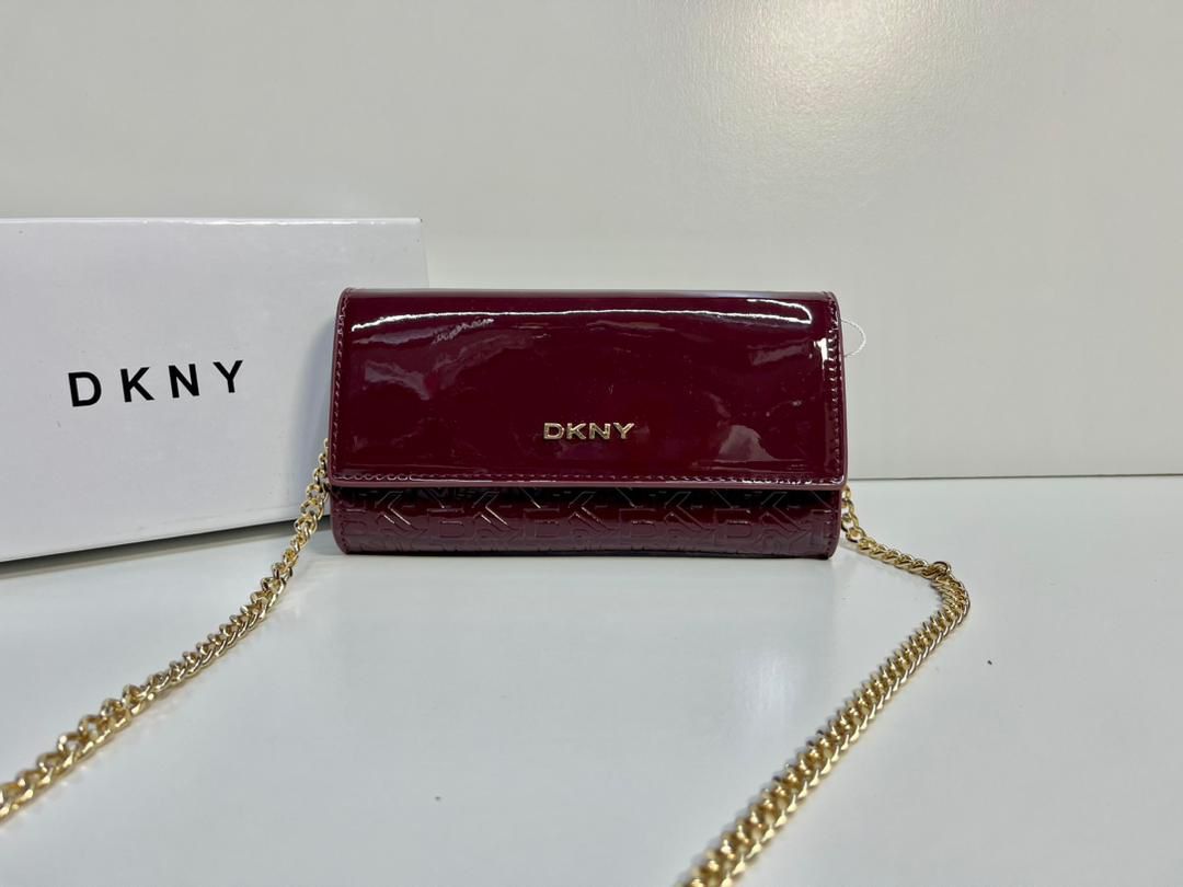 Red DKNY women’s crossbody bag with gold-tone chain