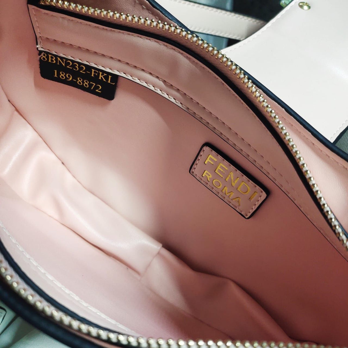 Close up view of Fendi style handbag gold hardware detail