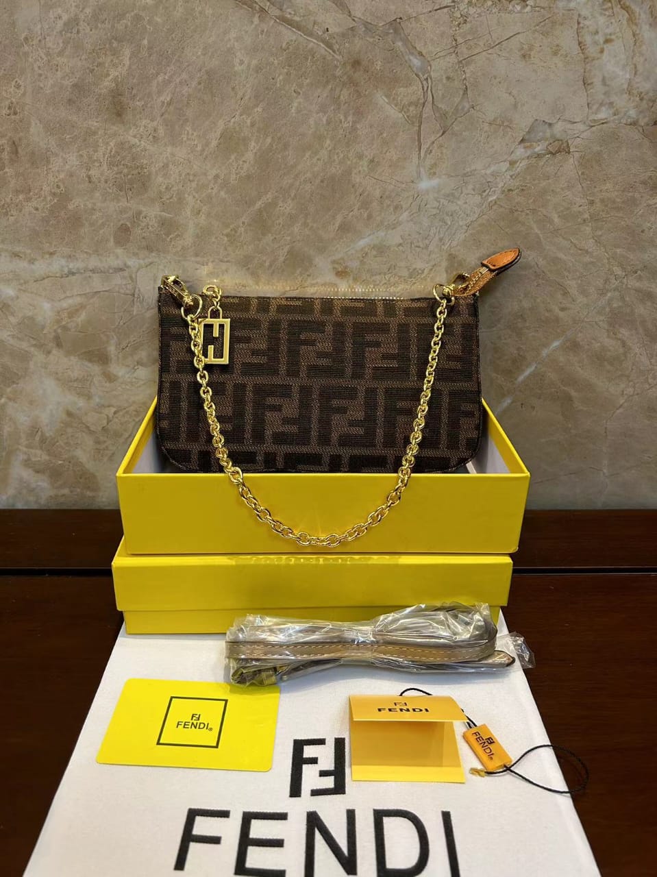 Fendi monogram shoulder bag angled view with gold hardware