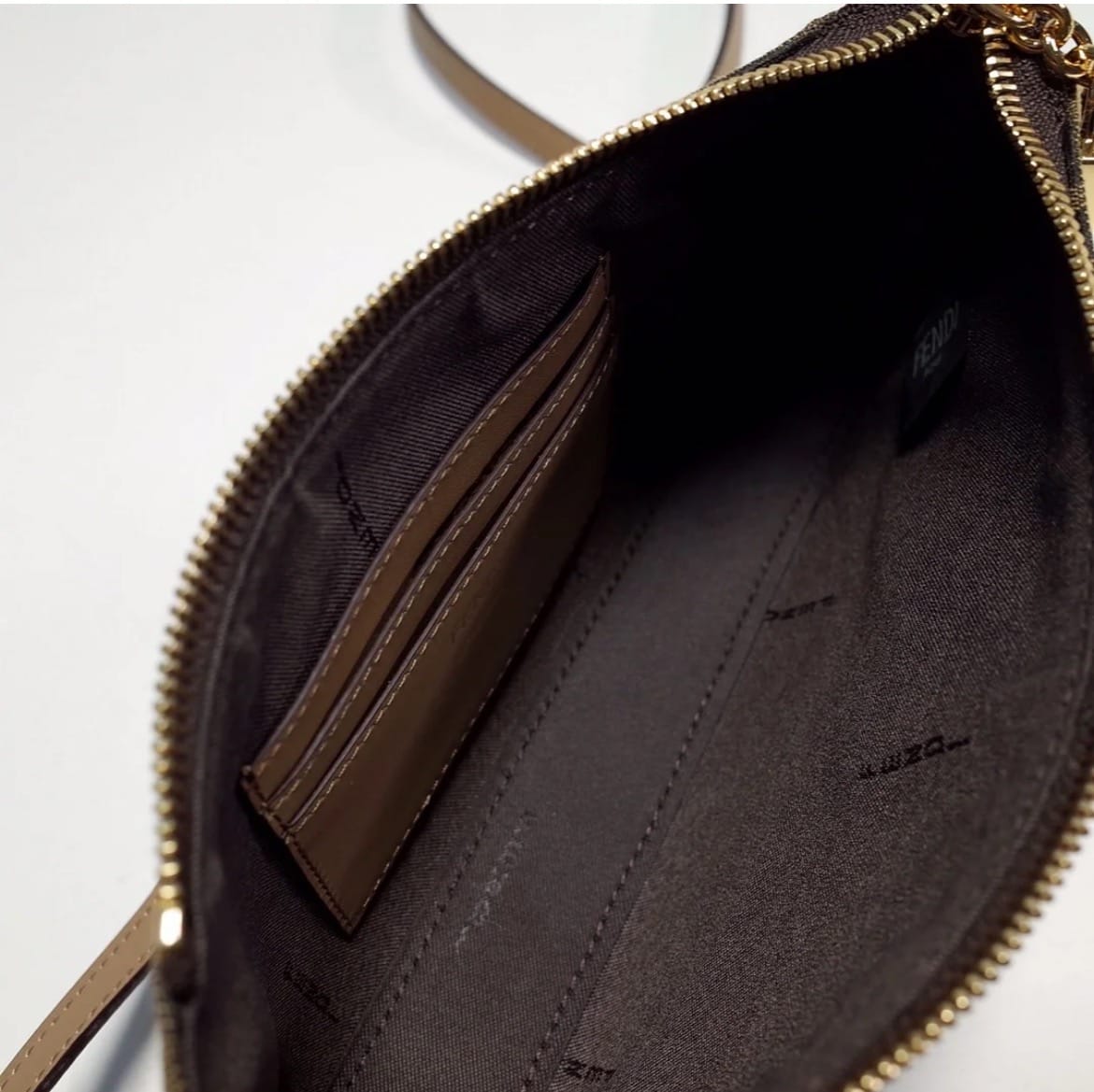 Fendi monogram shoulder bag interior with organized compartments