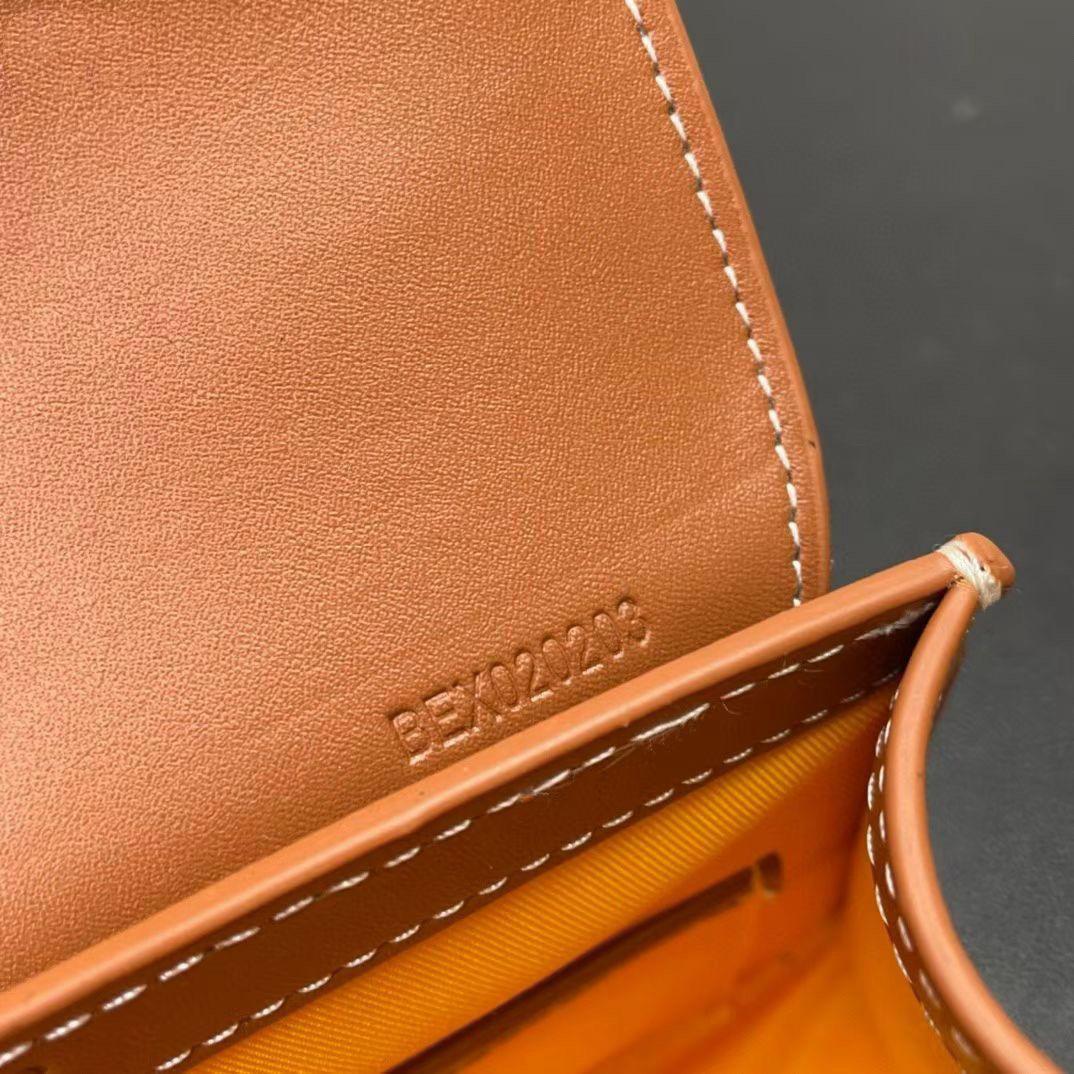 Close-up of a brown leather product with visible stitching and 'Bally' branding.