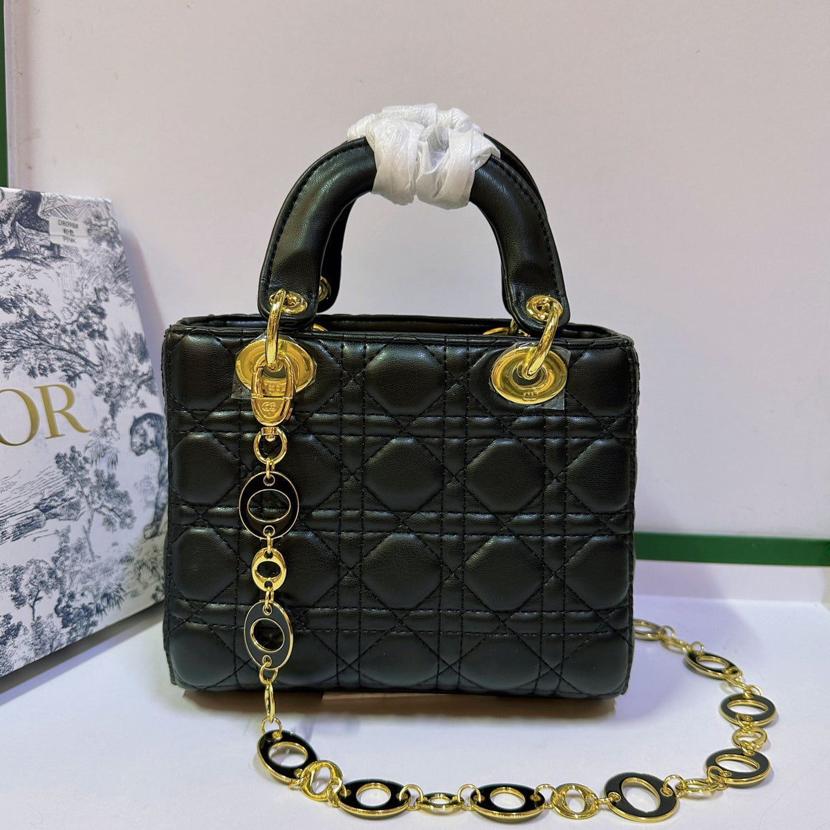 Green Dior style handbag with chain strap design