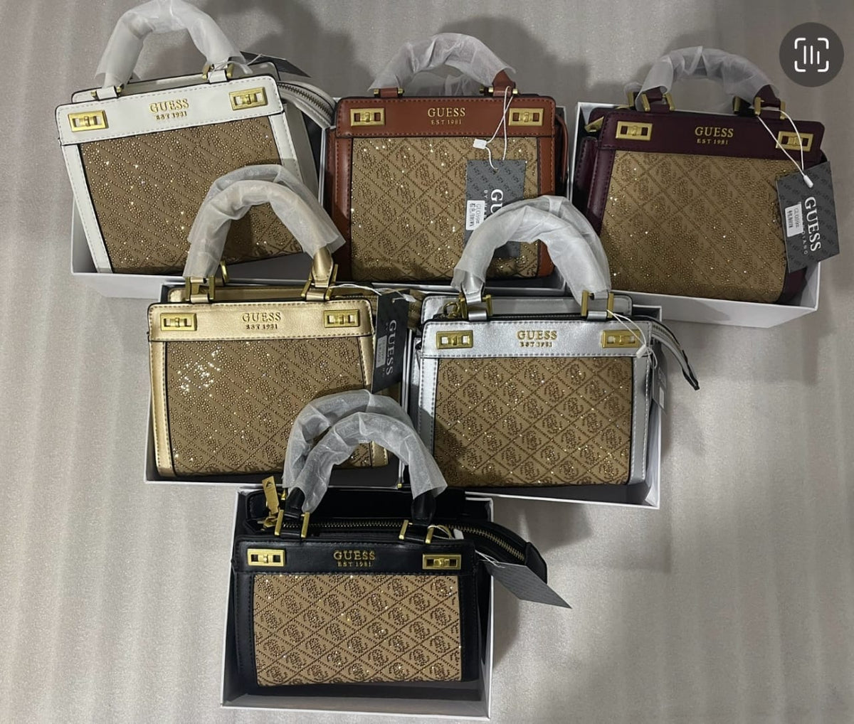 Guess women’s mini handbags in multiple colour options