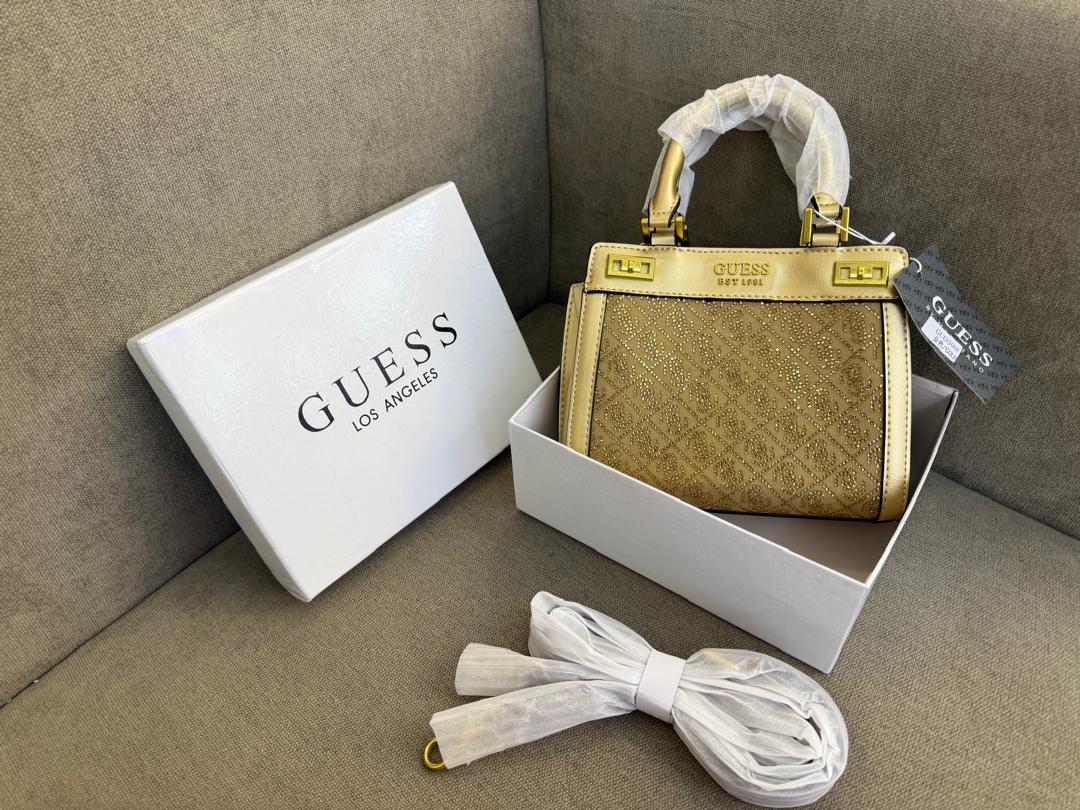 Gold-tone Guess women’s mini handbag