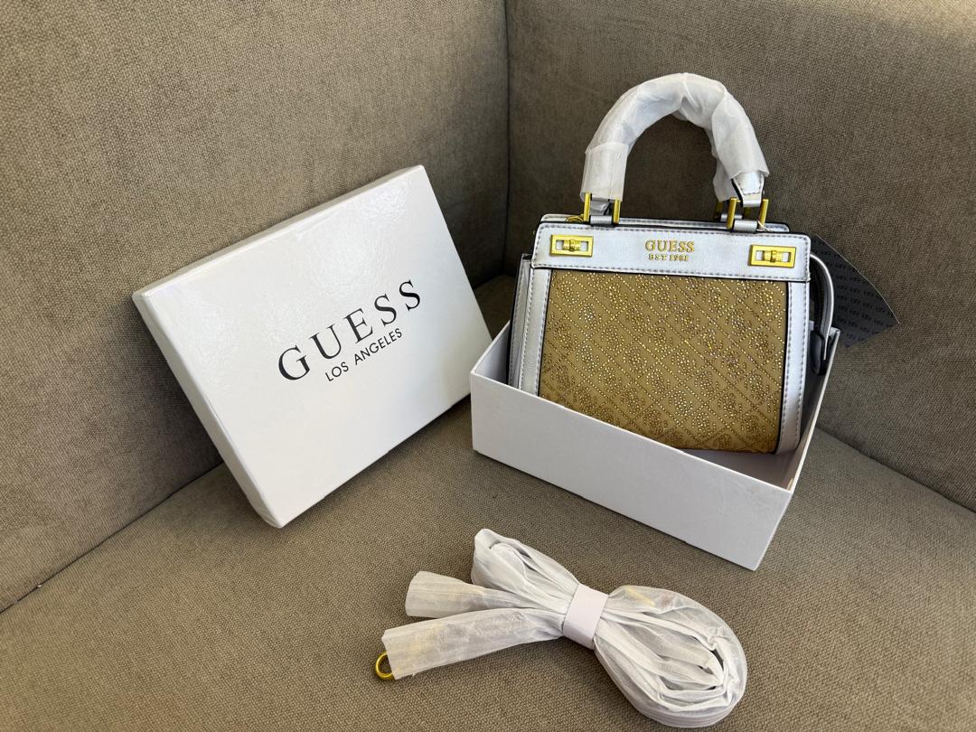 Light blue Guess women’s top-handle bag