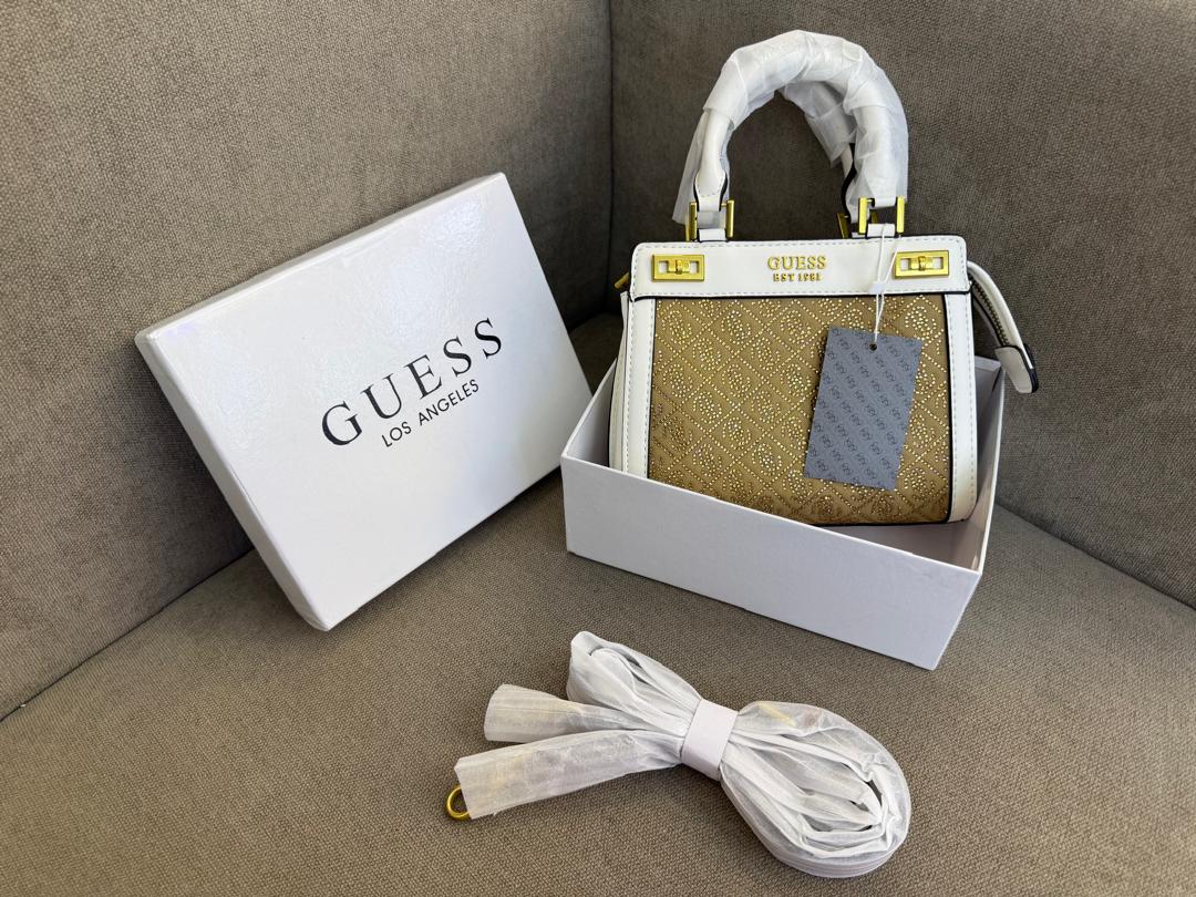 Mustard Guess women’s mini top-handle bag in UAE