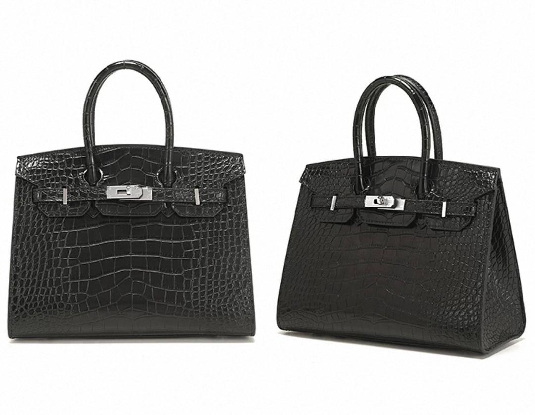 Two black Hermès women’s structured satchel bags