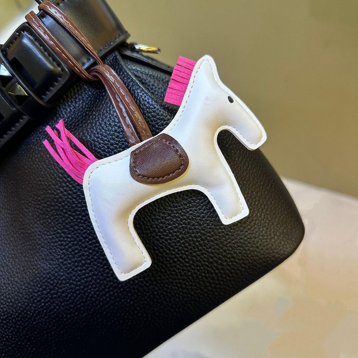 Luxury style handbag accessory and strap detail