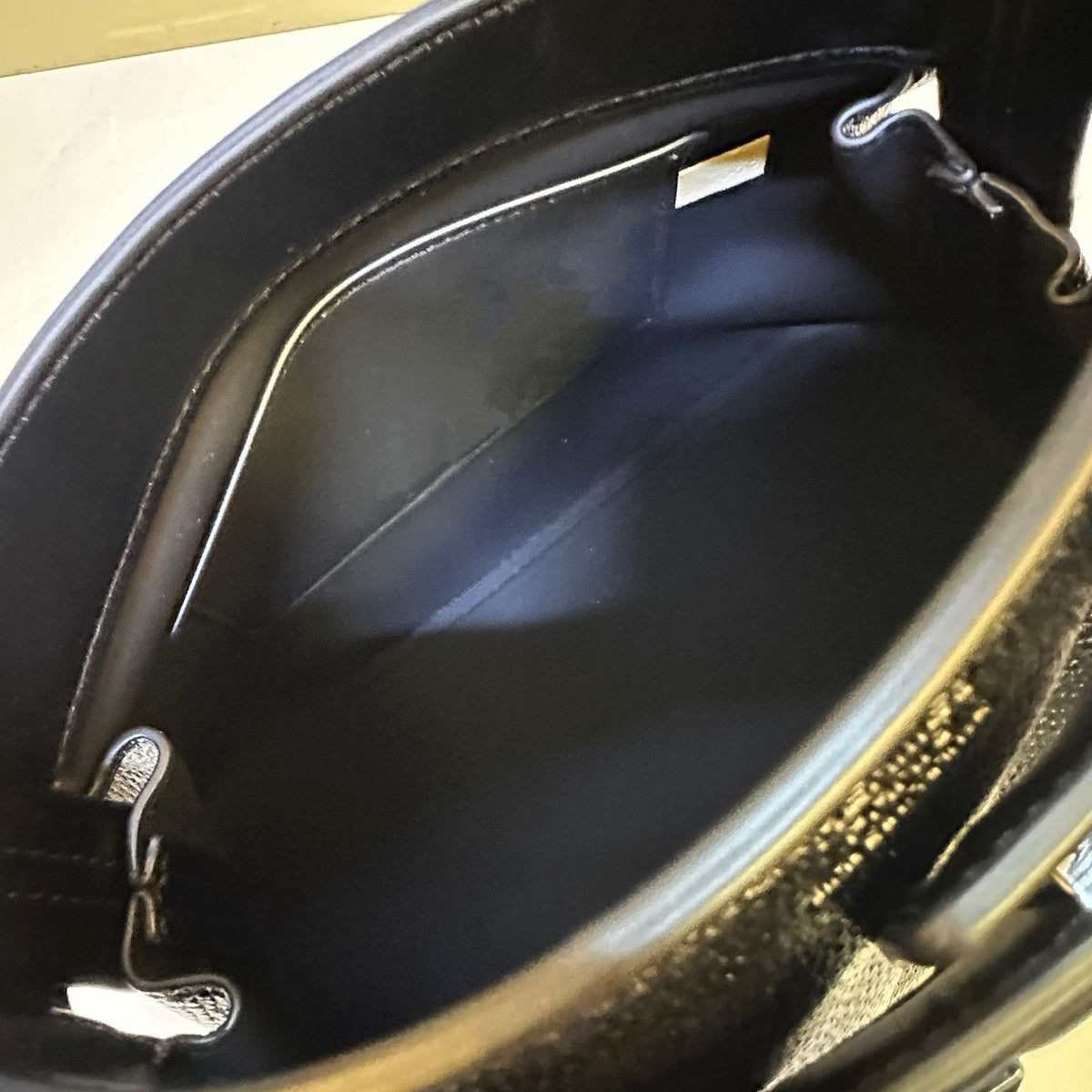 Interior compartment detail of Hermes style women's handbag