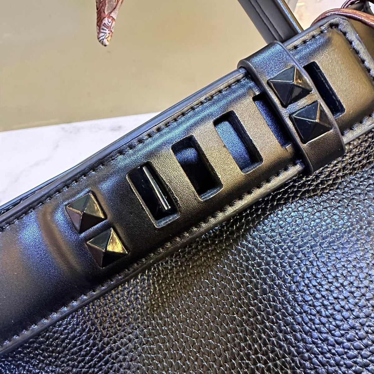 Side design view of elegant Hermes style women's handbag