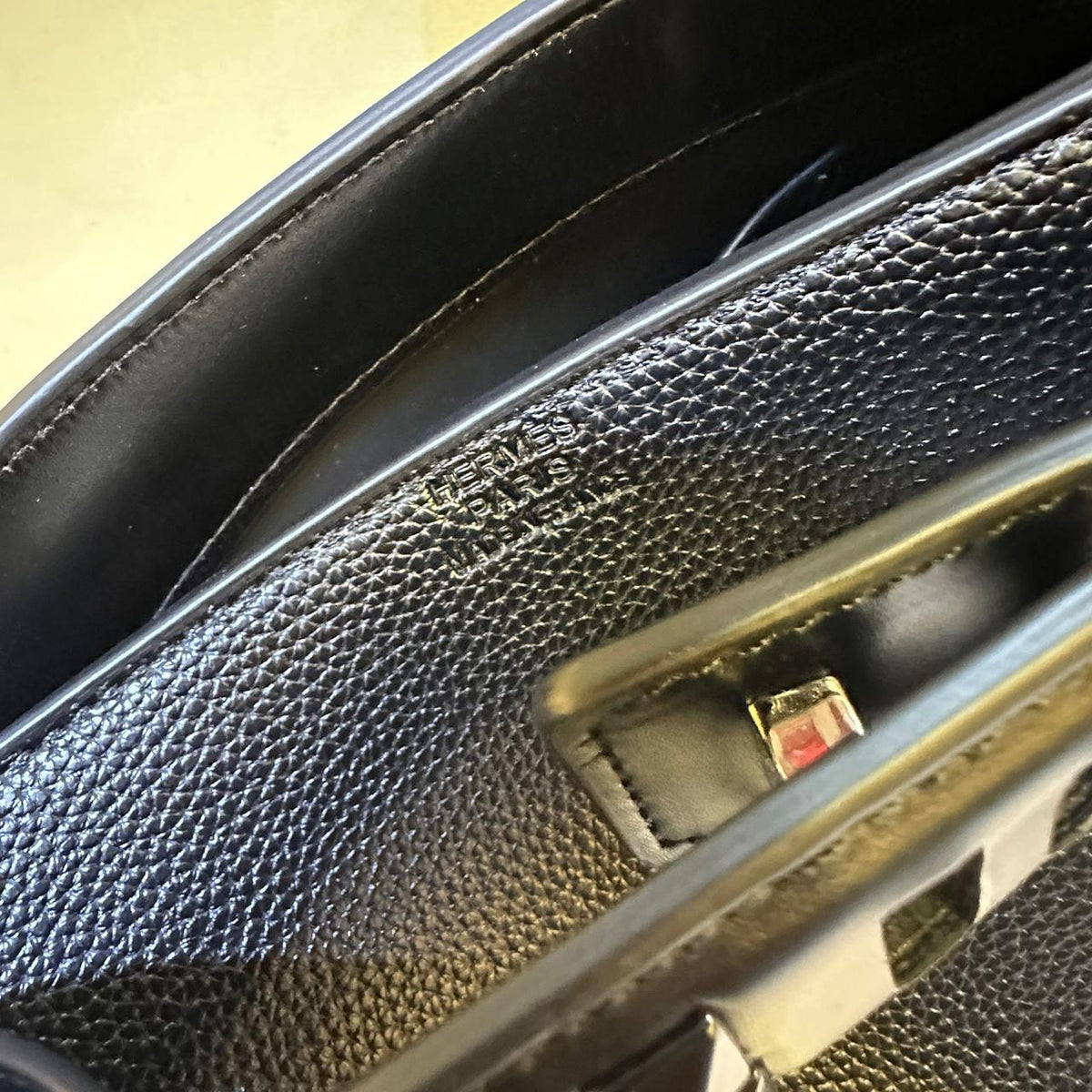 Close up view of premium textured Hermes style handbag material
