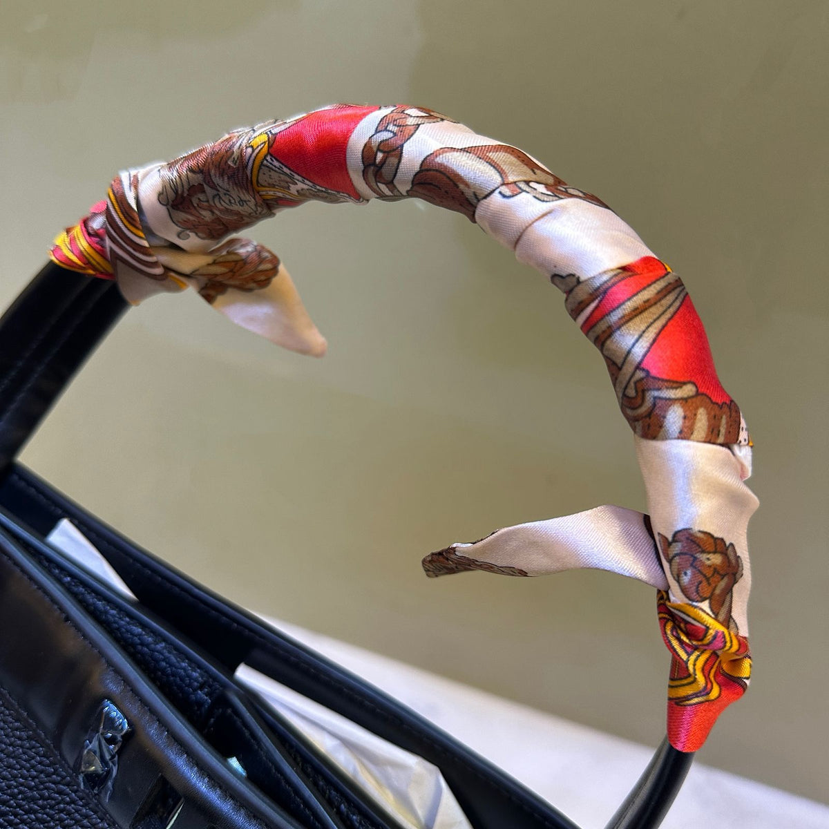 Top handle design detail of Hermes style handbag